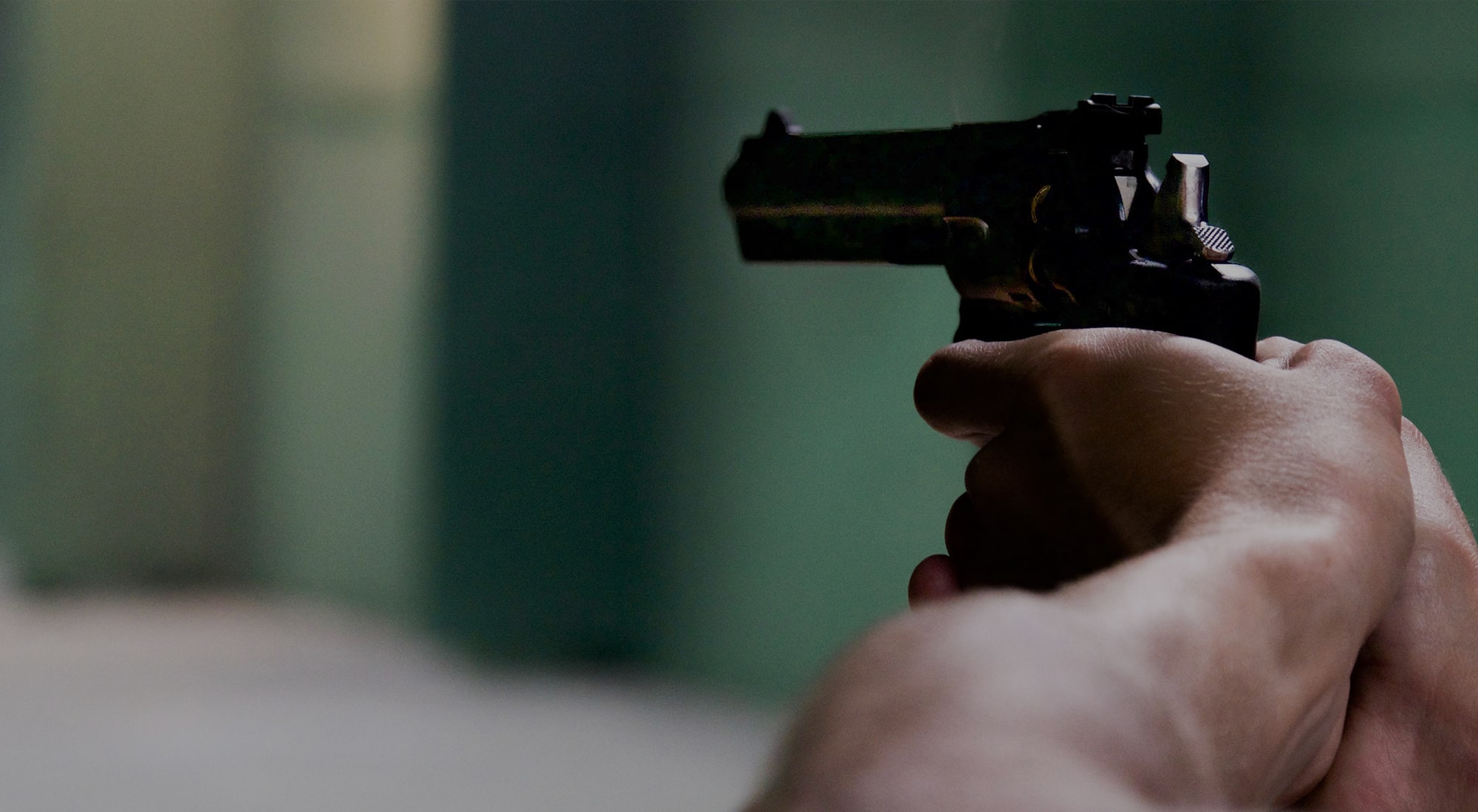 person pointing a gun